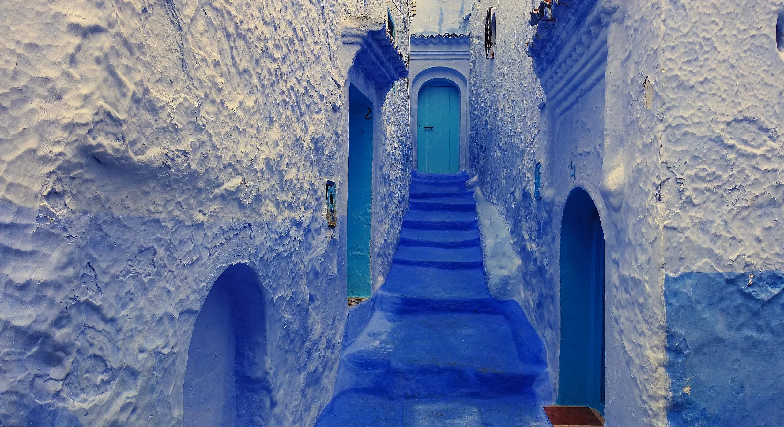A blue-washed stepped lane in the Chefchaouen medina