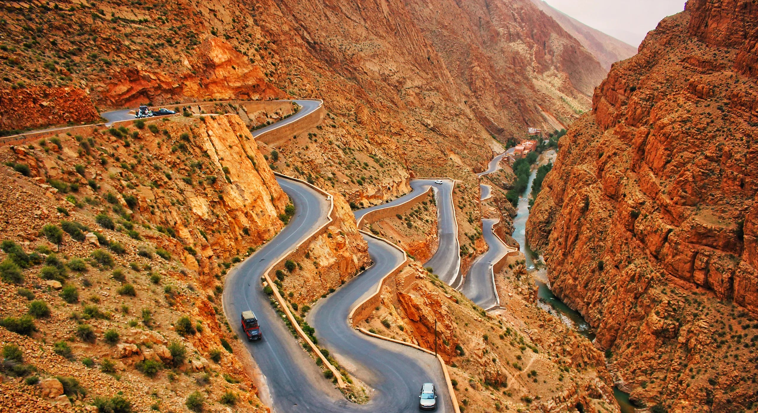 Hairpin bends of the road climbing out of the Dades Gorge between red rock walls