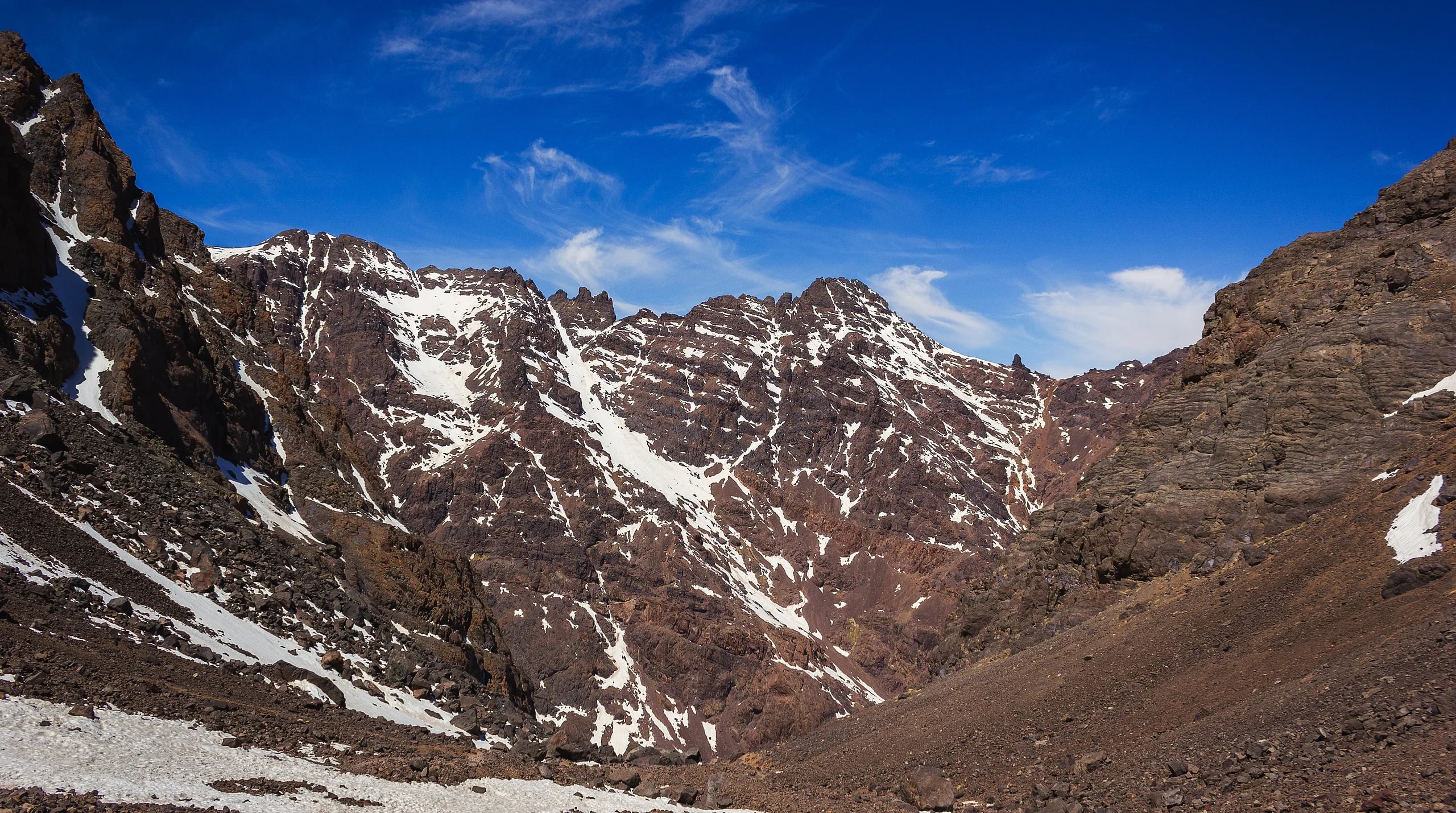 Trekkers on the trail to Mount Toubkal summit in the High Atlas Mountains